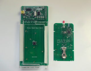 Programming fixture for remote PCB