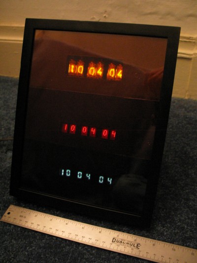 Ancient digital display clock with nixie, dot-matric LED and incandescent displays